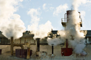 Steam emanating from industrial facility with steam distribution system in USA